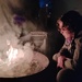 By the fire.