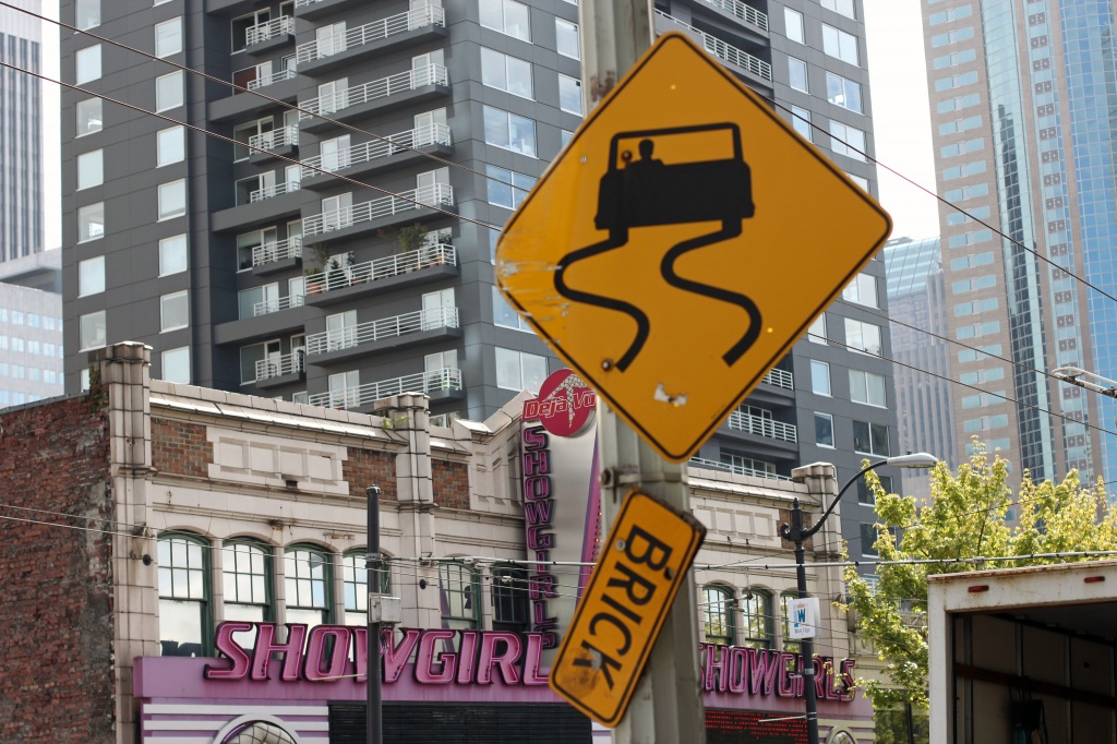 Was It The Showgirls Or The Falling Brick That Causes The Car To Swerve? by seattle