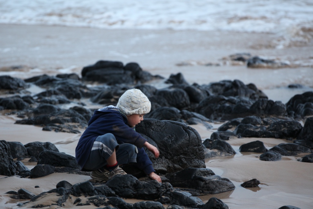 Callum fossicking in the rock pools by lbmcshutter