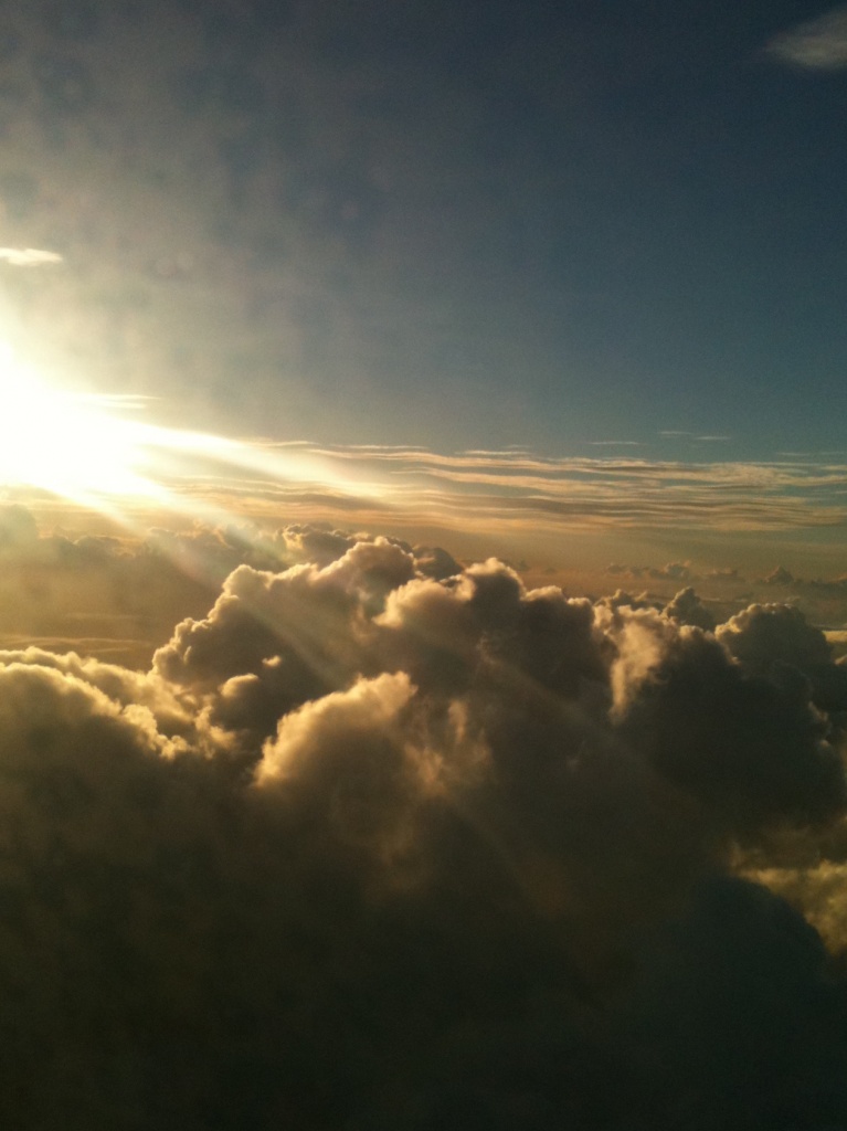 above the clouds, flying back to Christmas Island - iPhone shot through the plane window by lbmcshutter