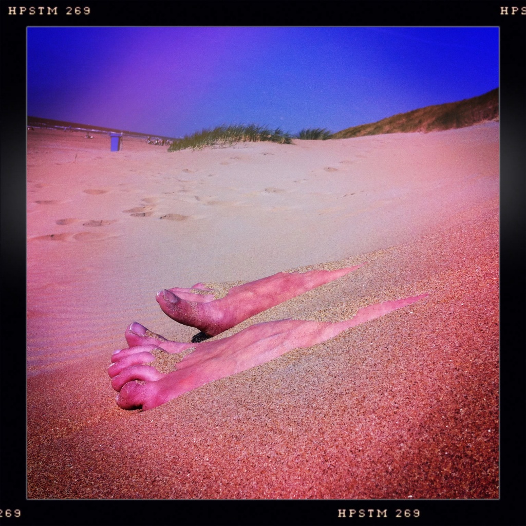 Hot feet on sunny beach by mastermek