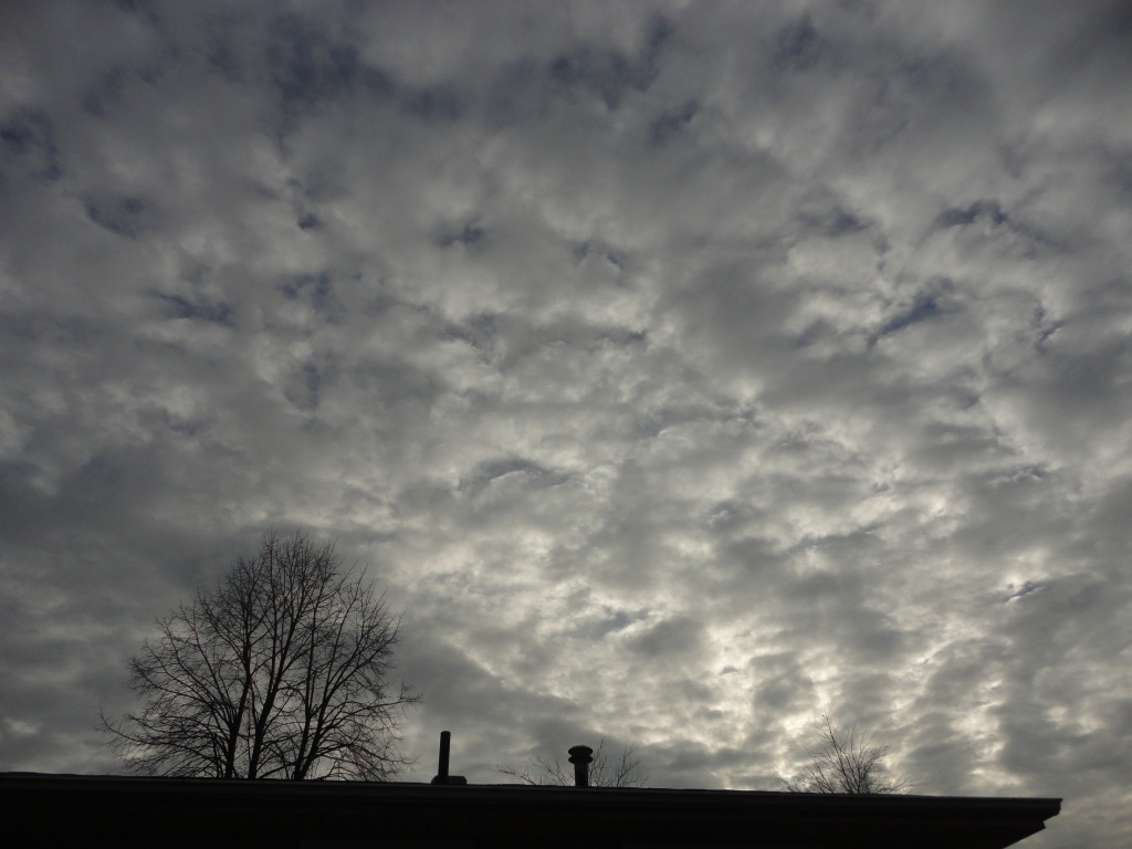 clouds over the roof of the house by harrowjet