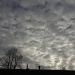 clouds over the roof of the house by harrowjet