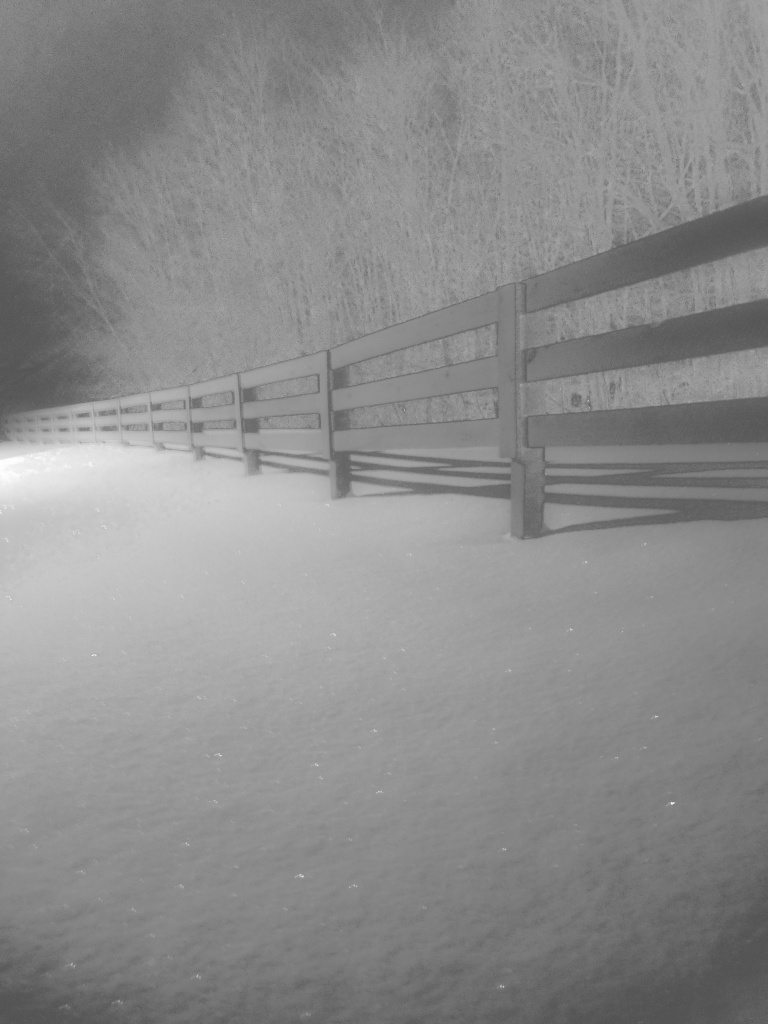 Fence rail in snow by ggshearron