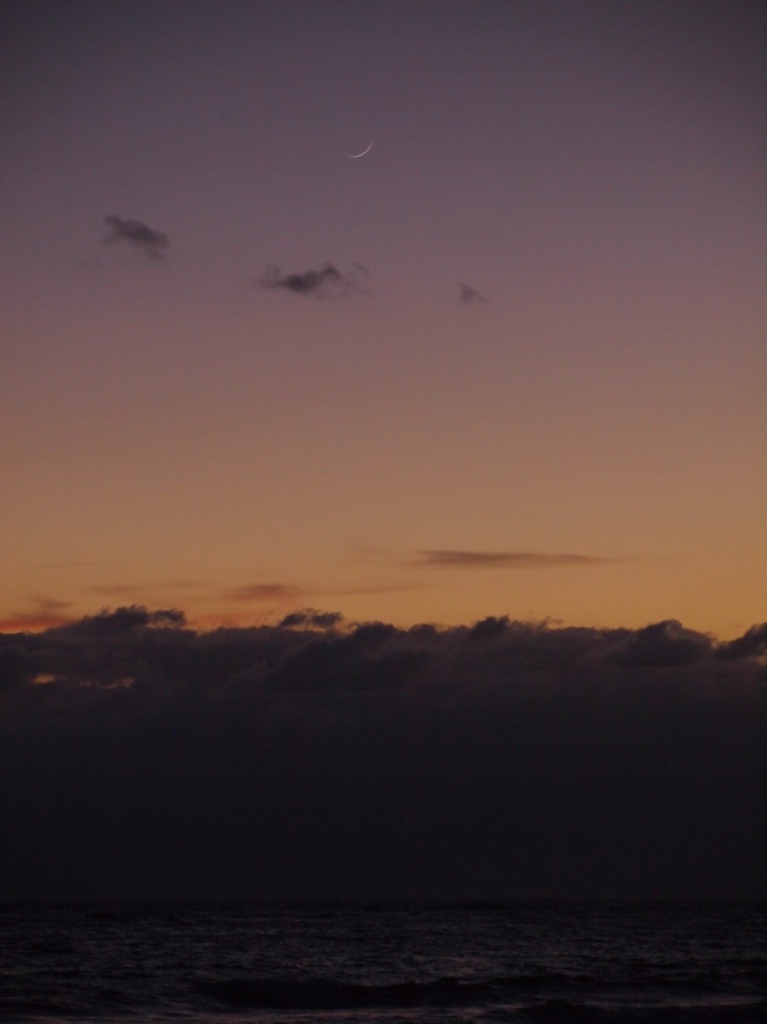 Crescent moon rising at dawn  by peterdegraaff