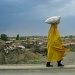 Another shot from a moving car - Afghan lady with her shopping by lbmcshutter