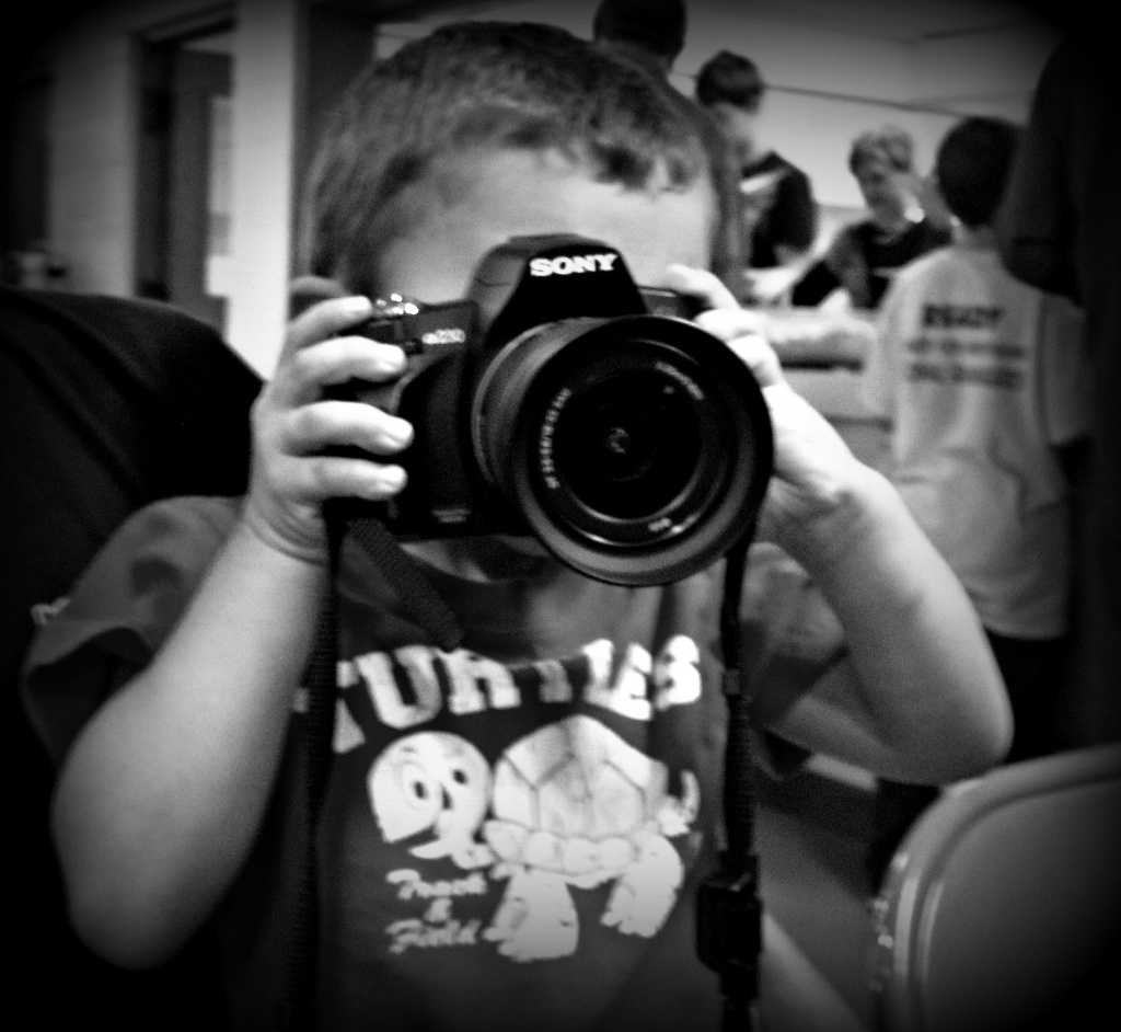 Toddler with BIG camera by myhrhelper