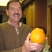 Ken with a Navel Orange from our Tree by Weezilou