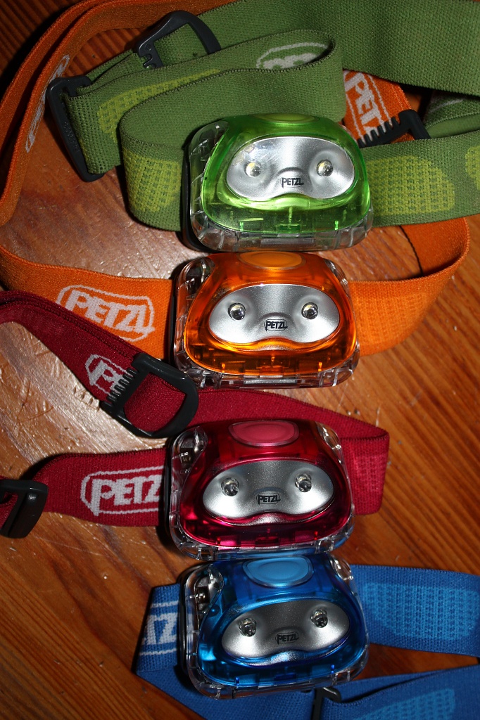 Four little headlamps sitting in a row by eleanor