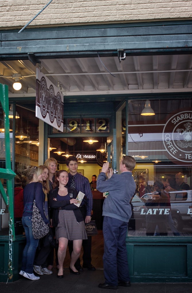 Another Family Photo In Front Of The Original Starbucks Coffee Shop! by seattle