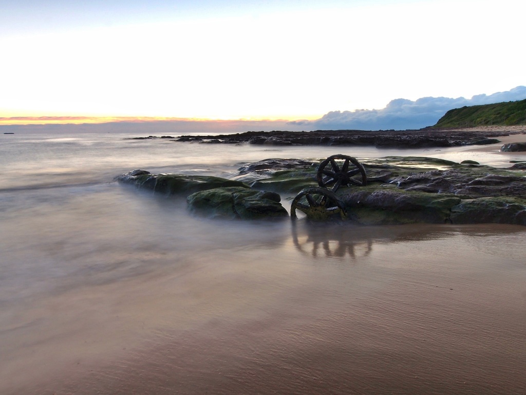 Wheels in the tide - dawn by peterdegraaff