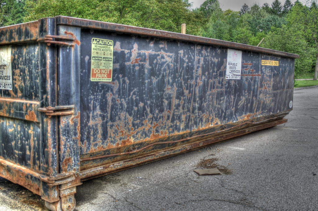 Rusty dumpster by mittens