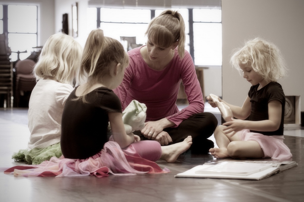 Miss Renee showing the girls a pair of pointe shoes by kiwichick