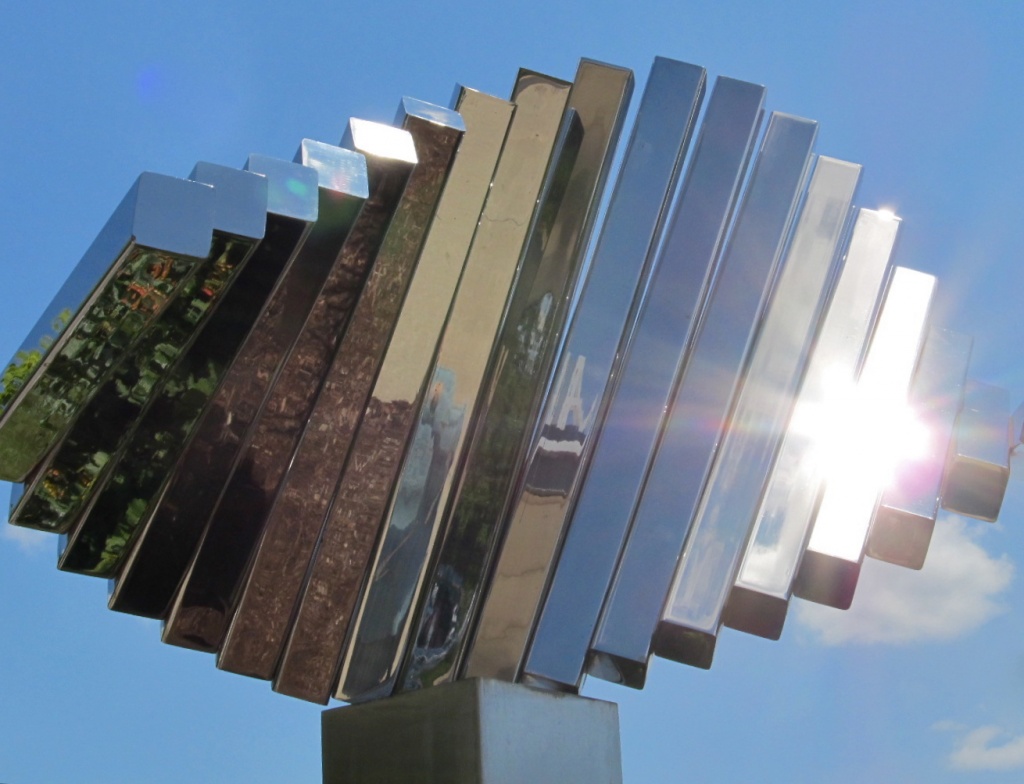 Shiny Metal Sculpture on a Sunny Day by houser934