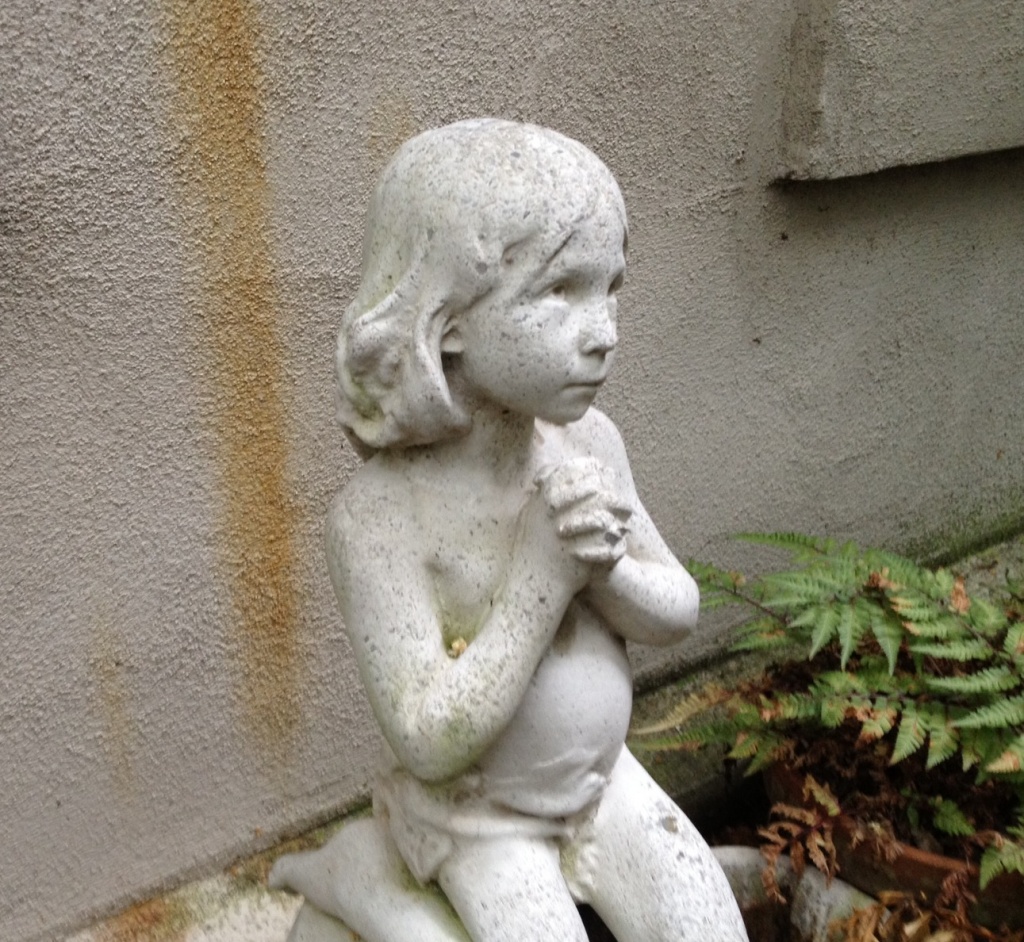 Comforting garden statue in a time of difficulty and anxiety. by congaree