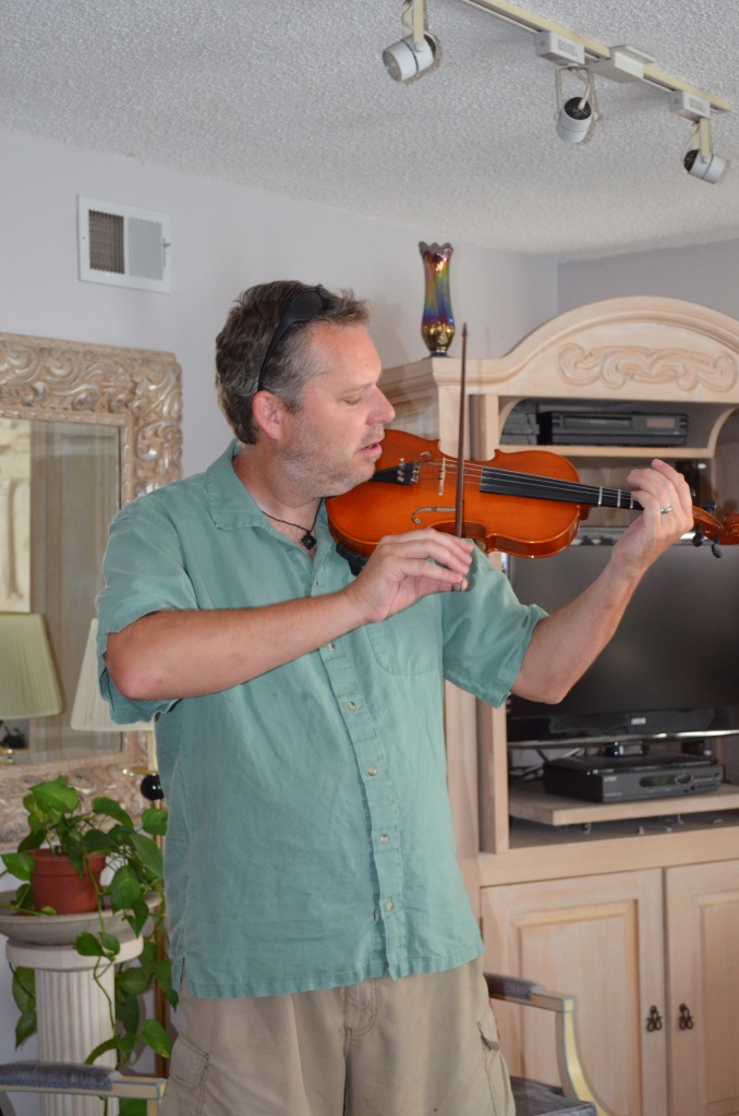 Eric tries the Violin by mariaostrowski