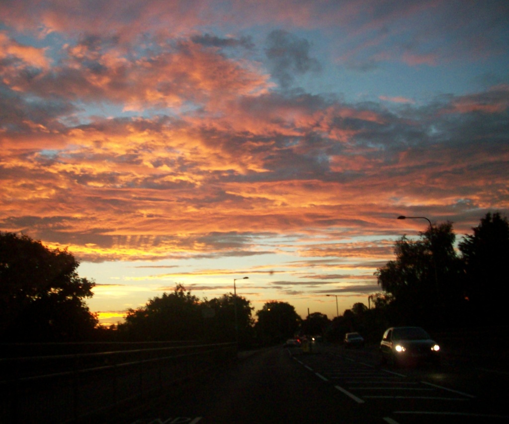 Sunset from a moving car by lellie