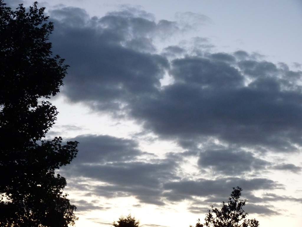 A few dark clouds at the end of a lovely day by lellie