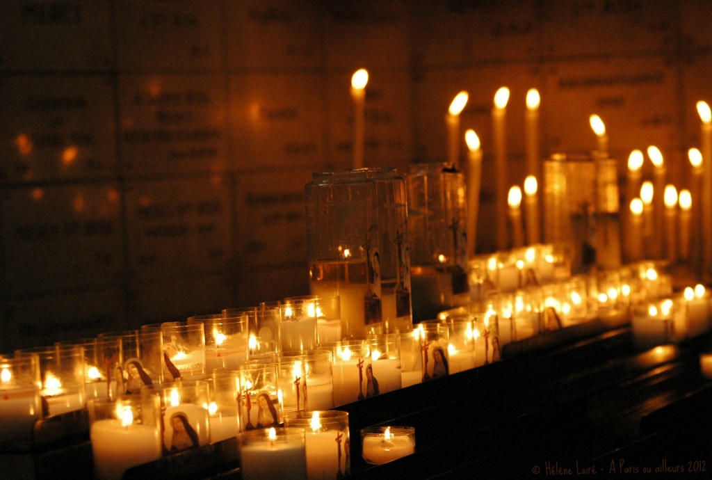 candles in the church by parisouailleurs