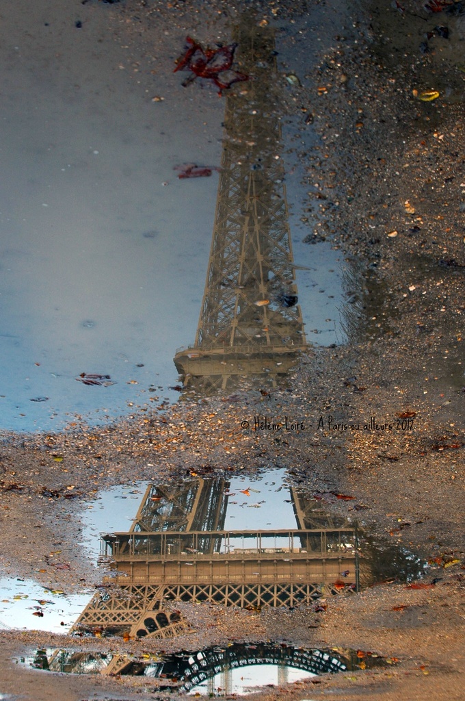 Eiffel tower in a puddle by parisouailleurs