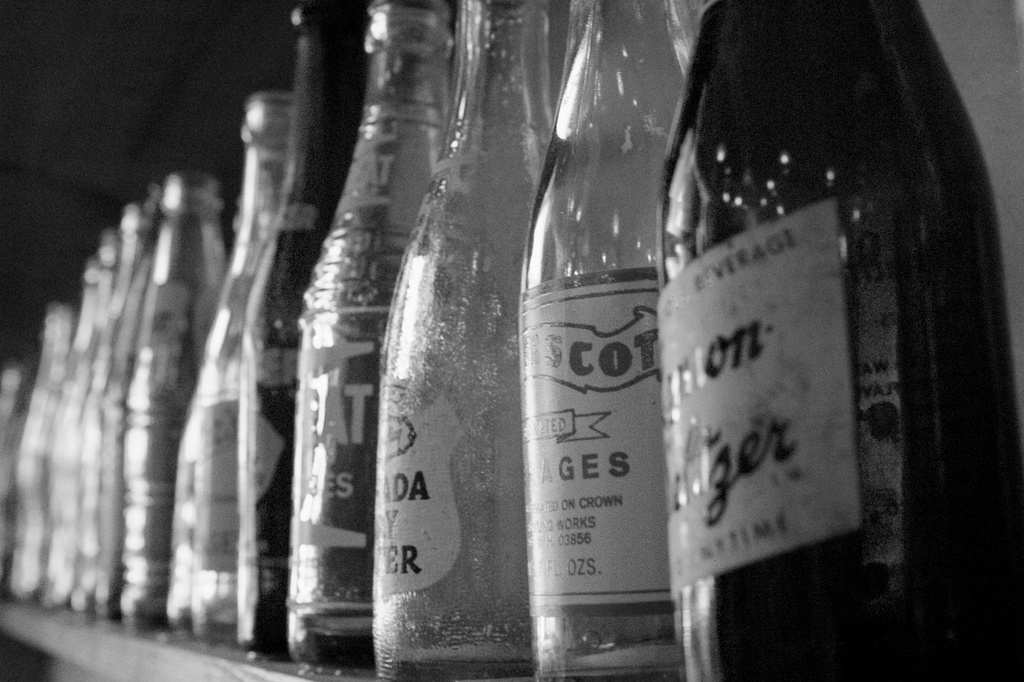 Empty Bottles on a Shelf by jyokota