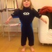 Milly trying on Sam's old wetsuit. by tallgate