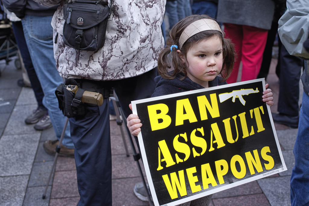 Who brings a hand gun to a Cease Fire March with children around... by seattle