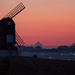 Windmill and misty sunset