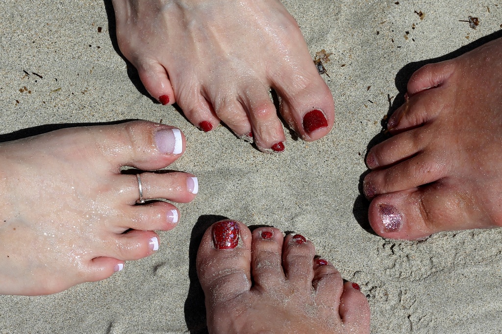 Feet in Jamaican sand by judyc57