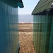 Between the beach huts by lellie