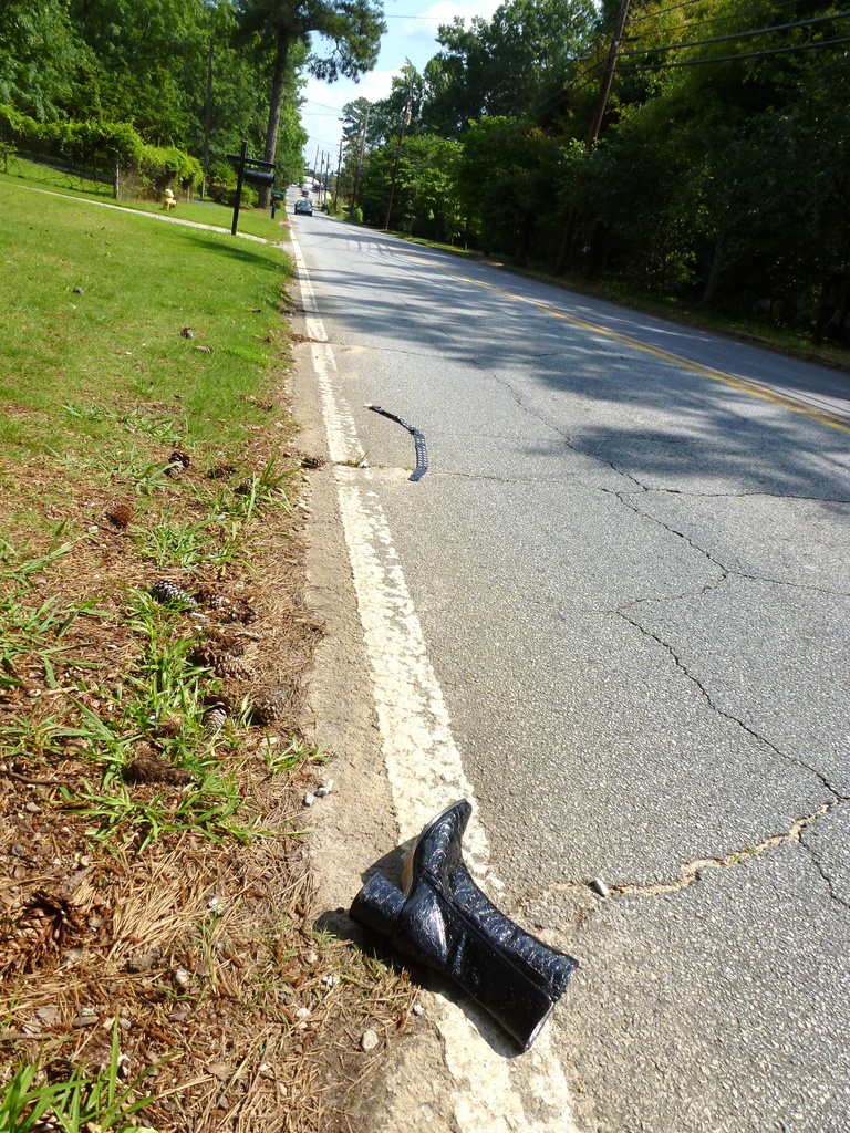Boot (and belt) in the road by margonaut