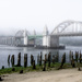 Siuslaw River Bridge Fog Burning Off  by jgpittenger