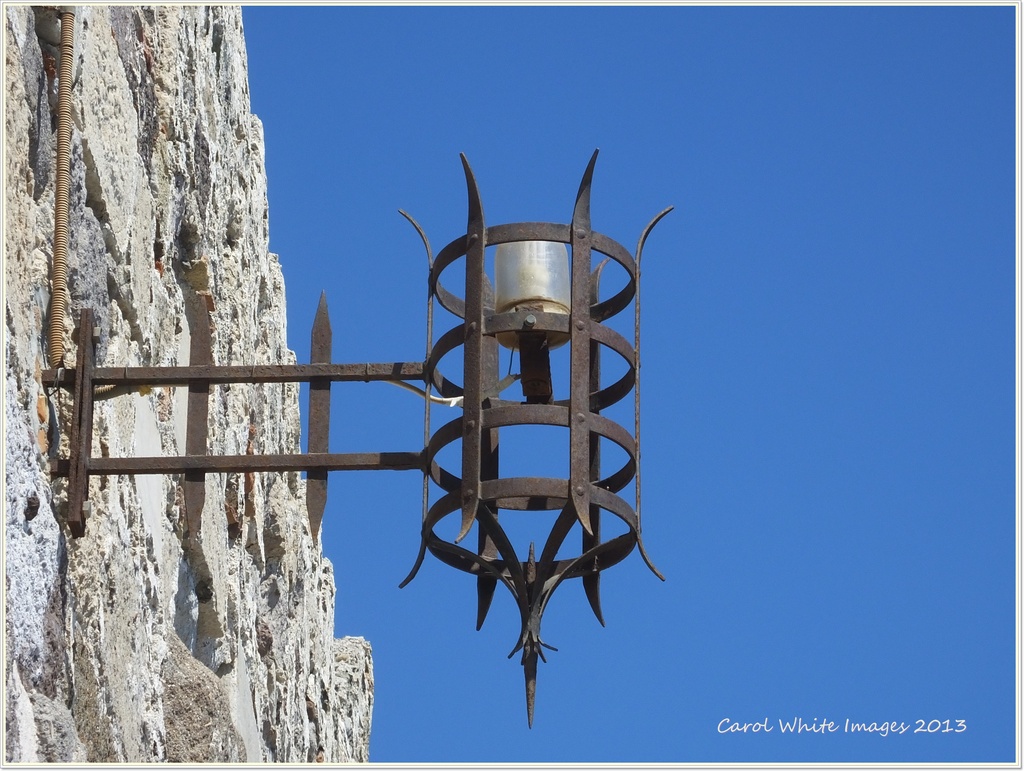 Lamp On Ancient Castle Wall. by carolmw