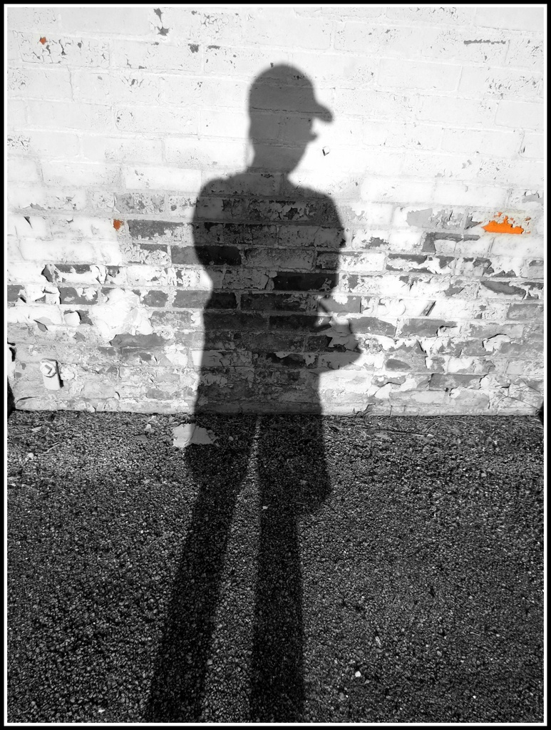 Brick Wall and Decrepit Asphalt Shadow-Selfie by juliedduncan