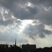 Skies over downtown Charleston with sun rays. by congaree