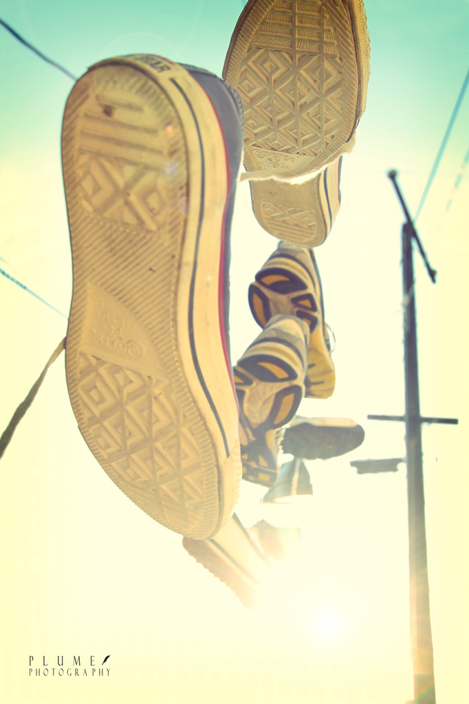 Shoes on a wire by orangecrush