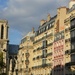 Notre Dame between buildings by parisouailleurs