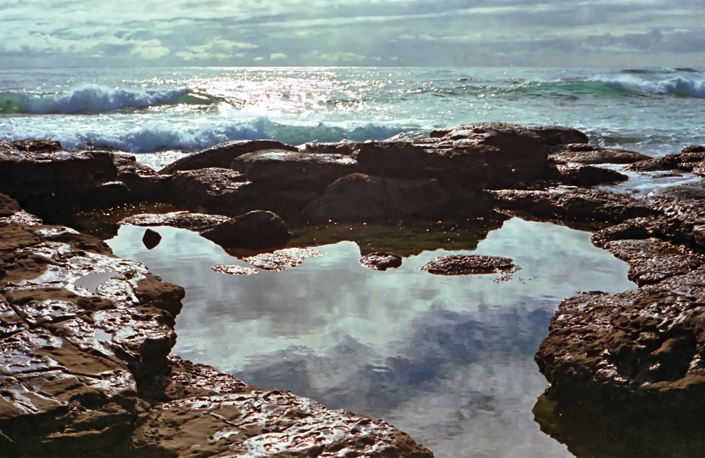 Waves beyond the pool by peterdegraaff