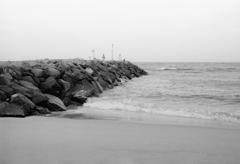 Fishing off the breakwall by peterdegraaff