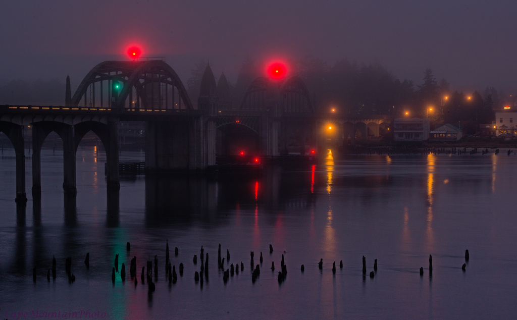 Traffic On the Bridge In Foggy Twilight by jgpittenger