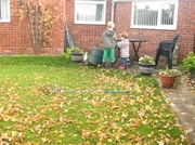 27th Oct 2013 - Two little grandchildren gathering leaves.