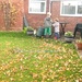 Two little grandchildren gathering leaves. by foxes37