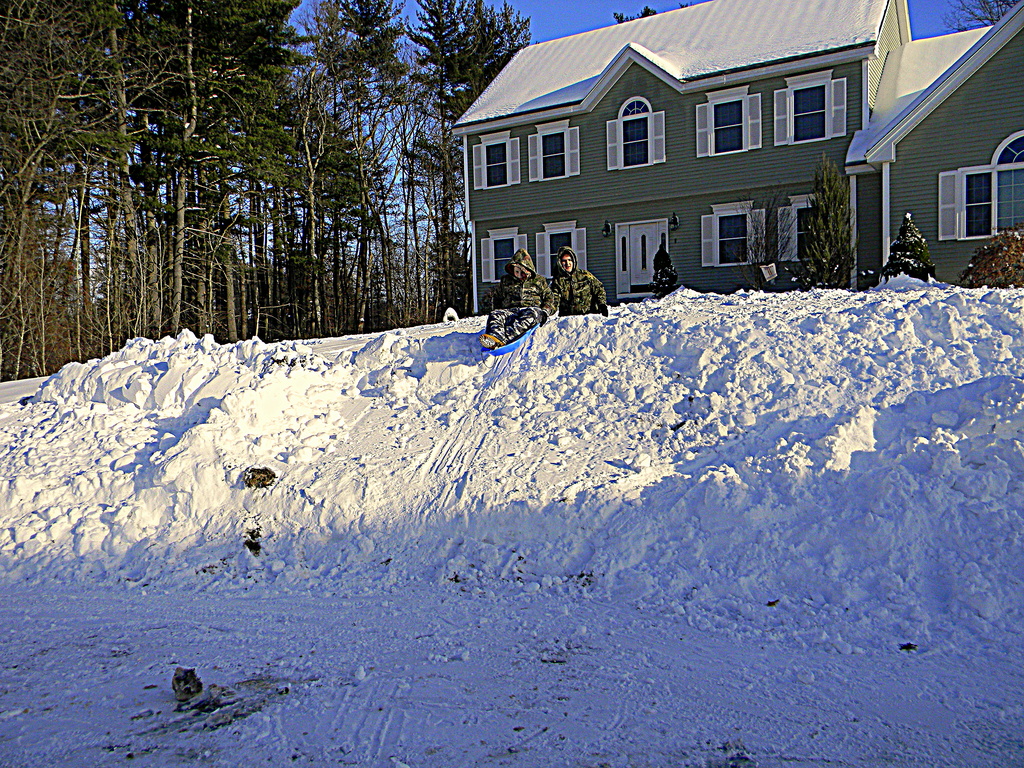 Sledding the snow pile! by homeschoolmom