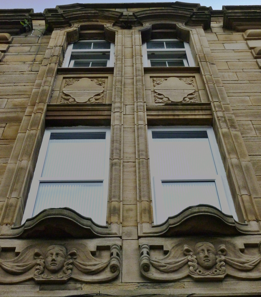 #348 Heads on a building Cavendish Street Keighley by denidouble