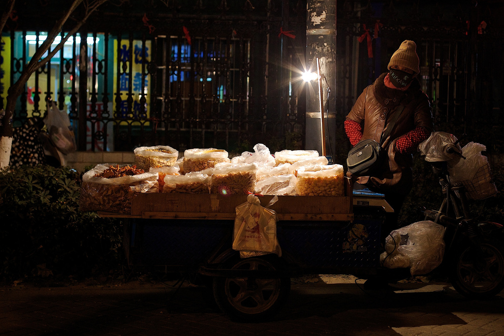 Street Vendor Selling Snacks by jyokota
