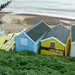 Battered beach huts by karendalling