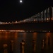 moon over san francisco's bay bridge by summerfield