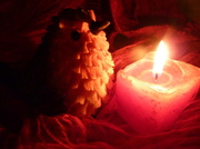 23rd Jan 2014 -   Warming myFfeathers. For todays jan. word flame/warmth.(6)wordstory.Cold robin.Finds candle.Warm again.
