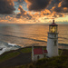 Horizontal Lighthouse At Sunset by jgpittenger