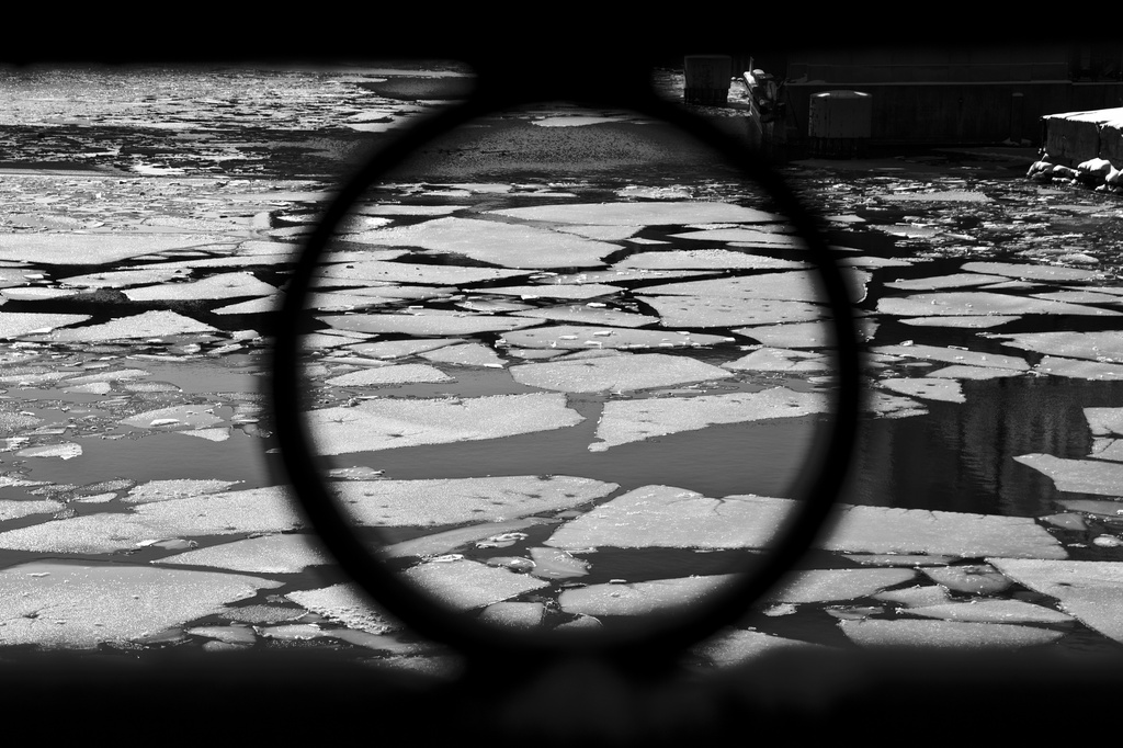 Frozen river, seen through the railing. by jyokota